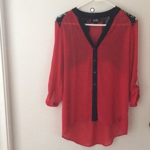 BY & BY GREAT LOOKING RED SHIRT WITH BLACK TRIM.